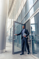 Afro American businessman with gadget