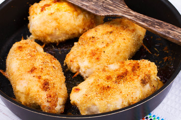 Chicken Breasts Stuffed with Cheese and Ham in Pan