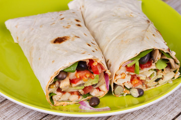 Chicken, Avocado, and Black Beans Burrito in Green Plate