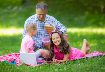 Father enjoying with your children at the picnic