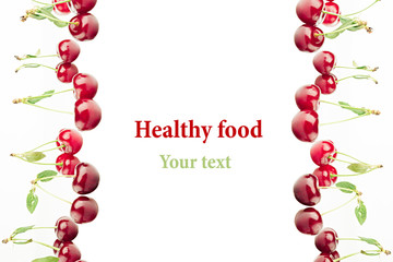 Framing of bunches of ripe juicy cherries on a white background. Isolated. Decorative fruit frame. Fruit background. Copy space.