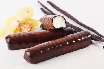 glazed curd with vanilla pods and flower, chocolate, , white background, isolated