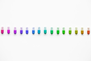 Row of rainbow capsules