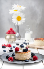 Ukrainian cheesecake with berries and cream, still life