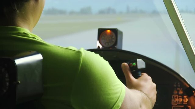 Private pilot sitting in cockpit showing thumbs up, flight simulator, cool hobby