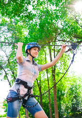 adventure climbing high wire park - people on course in mountain