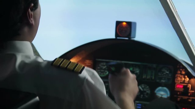 Confident airliner pilot flying in turbulence zone, keeping flight under control