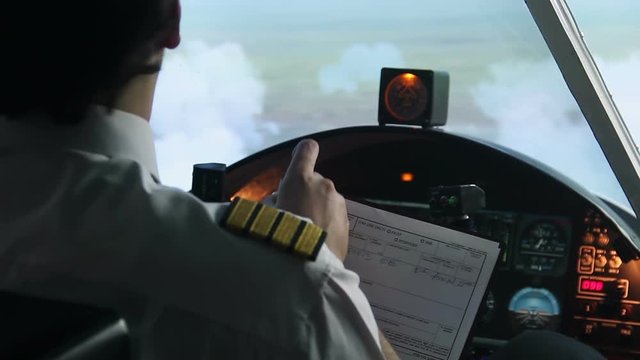 Pilot filling out flight documentation, plane flying in autopilot mode, tourism