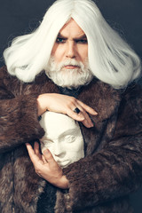 bearded man with sculpture head