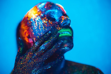 Girl colored fluorescent powder.
