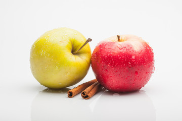 apples and cinnamon isolated on white