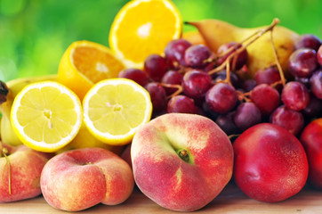 Naklejka na ściany i meble peaches,pears, grapes and sliced citrus fruits