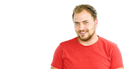 Obraz premium Portrait of handsome bearded young man with beaming smile