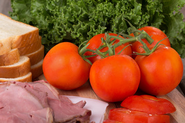 Fresh Vine Tomatoes With Sliced Roast Beef, Bread and Lettuce