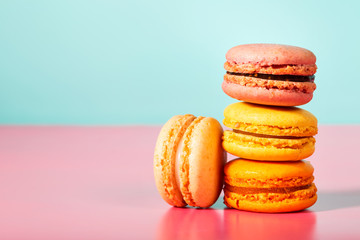 Stack of macarons on pastel background