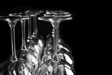 Empty wine glasses on black background, closeup