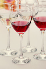 Wine glasses with red and white wine, closeup