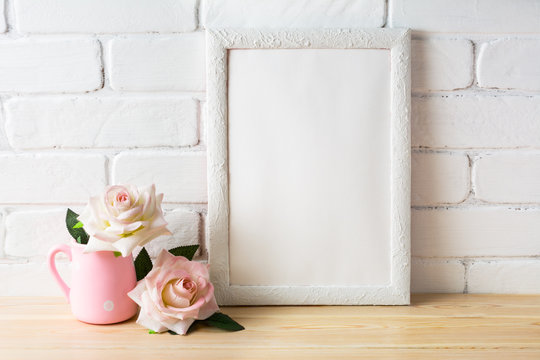 White frame mockup with two pale pink roses