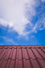 roof tops on a house with a blue sky