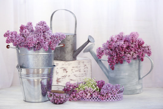 Bouquets of spring flowers on light background