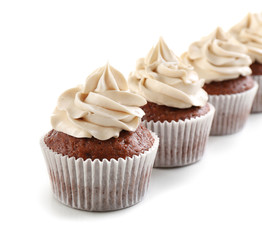 Tasty chocolate cupcakes, isolated on white