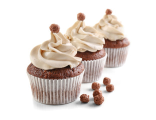 Tasty chocolate cupcakes, isolated on white