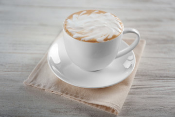 Cup of coffee on wooden table