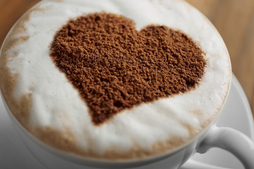 Cup of coffee with creative pattern, close up