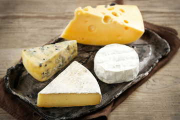 Cheese on tray on wooden table