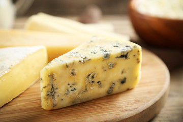 Cheese on wooden cutting board