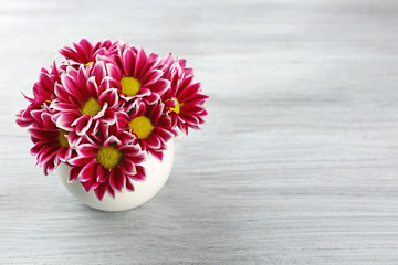 Violet chrysanthemum on wooden table
