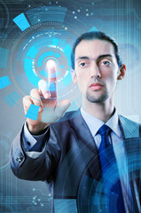 Businessman pressing virtual buttons in futuristic concept