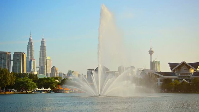 FullHD video - Beautiful, decorative fountain sprays water skyward from the surface of Titiwangsa Lake at a downtown park in Kuala Lumpur, Malaysia.