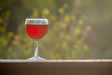 bright red wine in the glass on the table