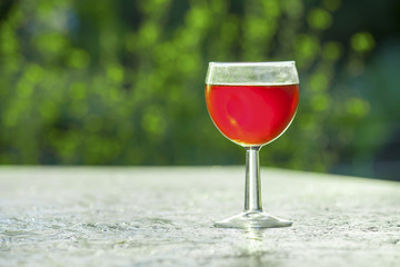 bright red wine in the glass on the table