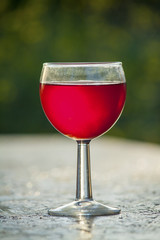 bright red wine in the glass on the table