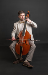 man playing the viola da gamba