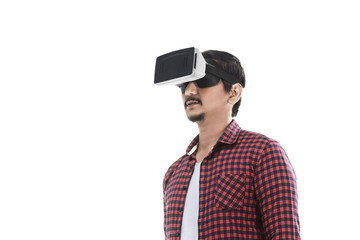 Young asian man experiencing virtual reality through a VR headset