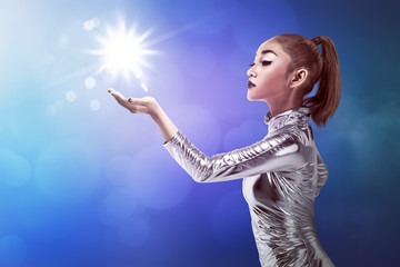 Young pretty asian woman touching digital hologram