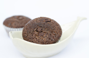 Banana cup cake on white ceramic bowl on white background