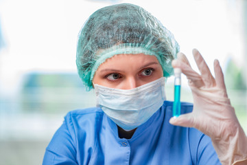 Experienced lab assistant working on chemical solutions