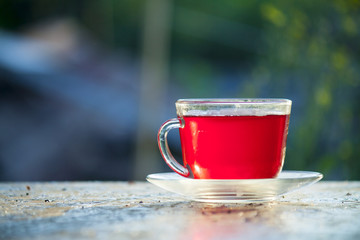 Red tea in a glass mug