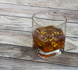 Closeup of a glass of whisky with ice cubes