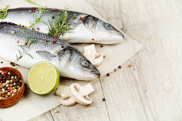 Raw seabass fish on the wooden board