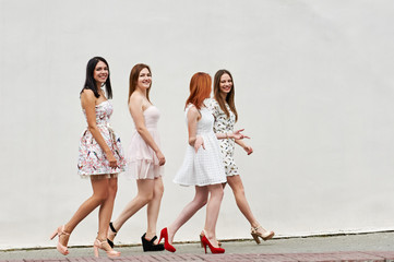 Fototapeta premium four walking of young women friends