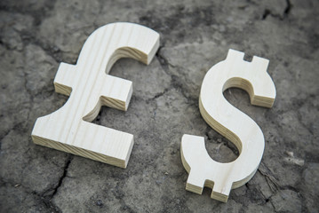 Exchange currency pound sterling and dollar on a dry land