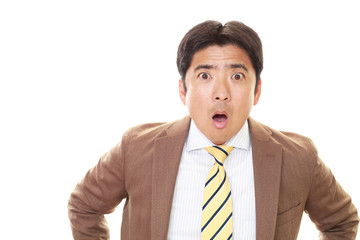 驚いた表情のビジネスマン