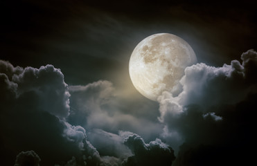 Obraz na płótnie Canvas Nighttime sky with clouds, bright full moon.