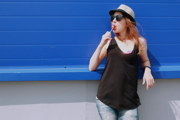 hipster girl at the blue wall