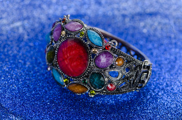 Jewellery ring against blue background